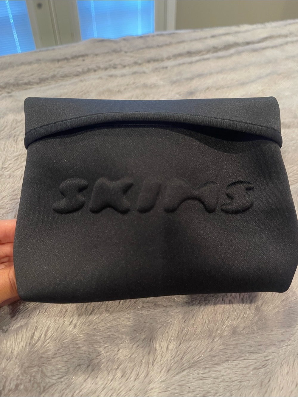 SKIMS Black Neoprene Cosmetic Pouch - Embossed Logo